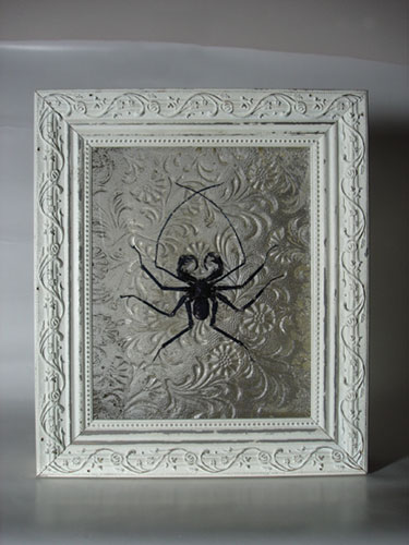 Sculpted insects cast in glass